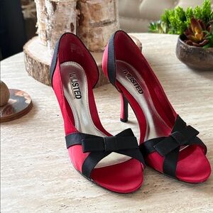 Unlisted Red and Black Bow Heels with leather sole.